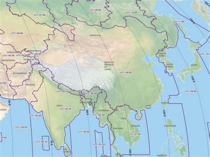 When did China change to one time zone?